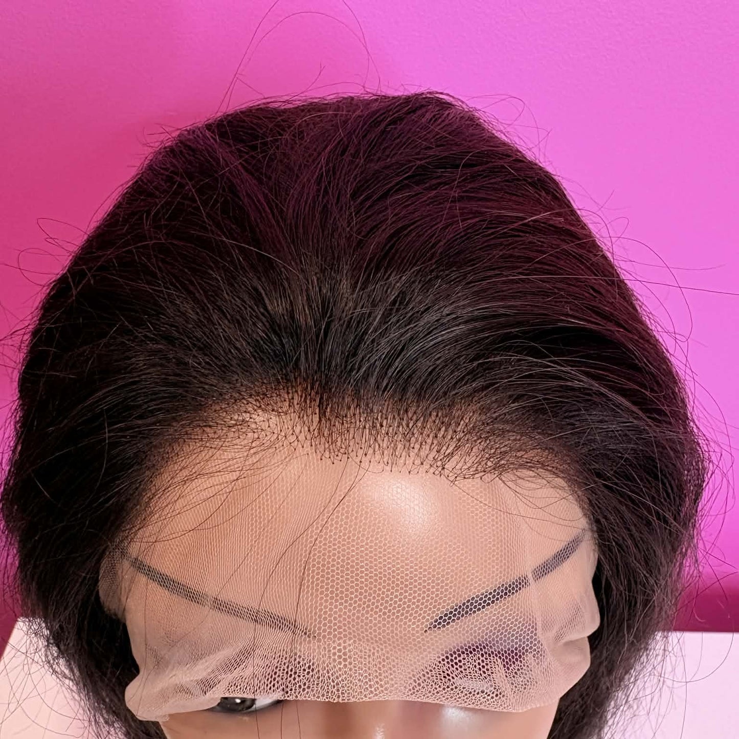 Close-up of HD lace hairline on 20 inch straight lace front human hair wig showing transparent lace and baby hairs