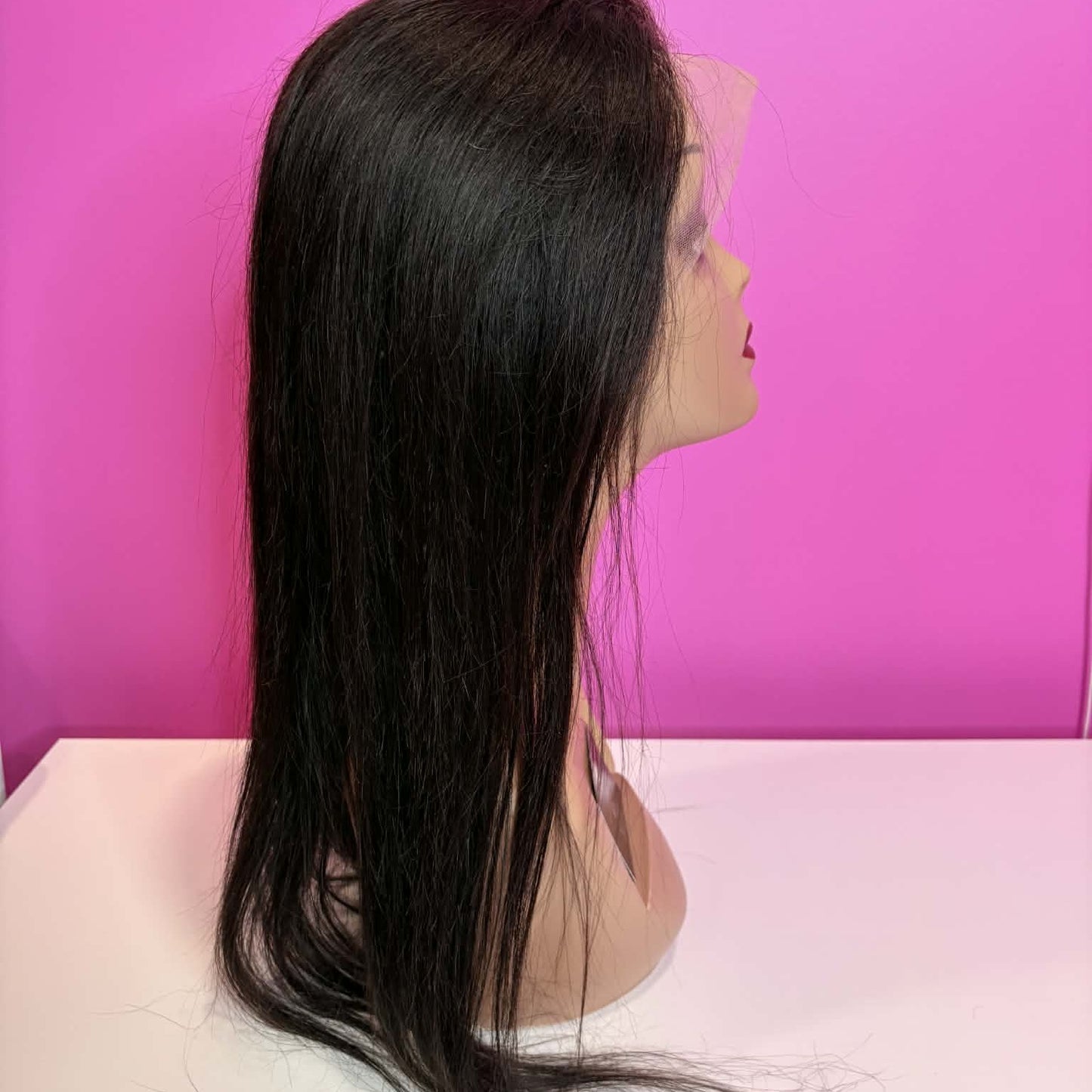 Left side profile of 20 inch straight 13x4 HD lace front human hair wig on mannequin showing length and straight texture