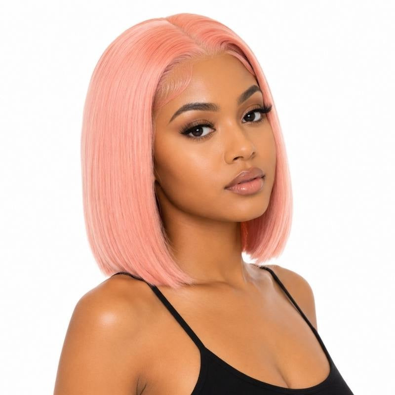Model wearing a cotton candy pink straight bob human hair wig with a middle part and a blunt cut at the jaw