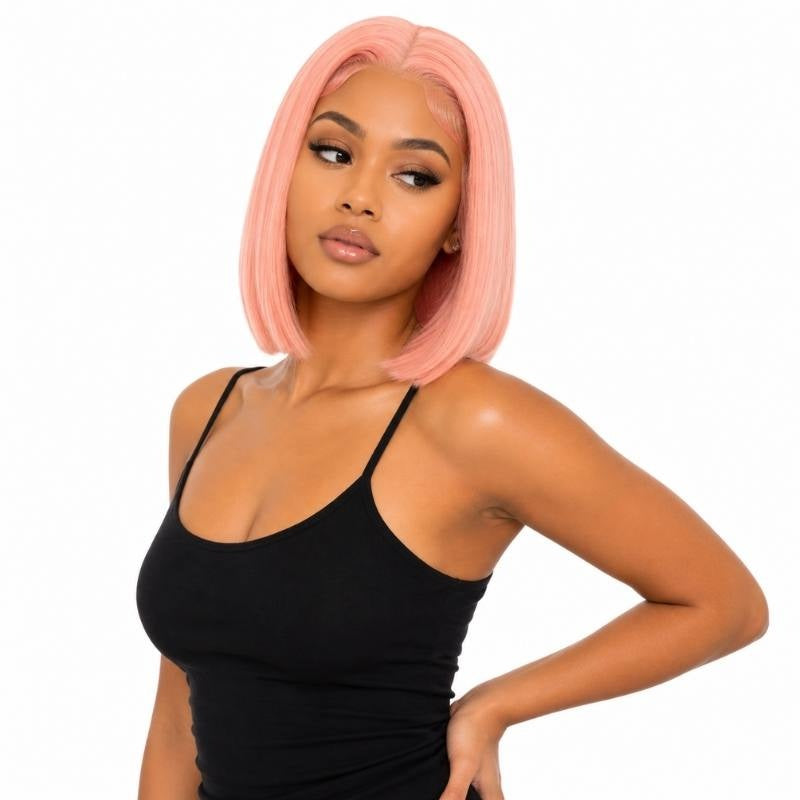 Model looking to the side wearing a cotton candy pink straight bob human hair wig with a middle part and blunt ends