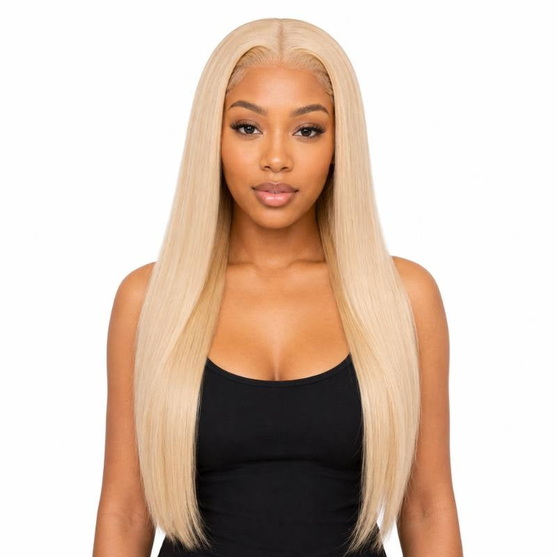 Model wearing a blonde straight human hair wig with a middle part and long straight lengths on a white background