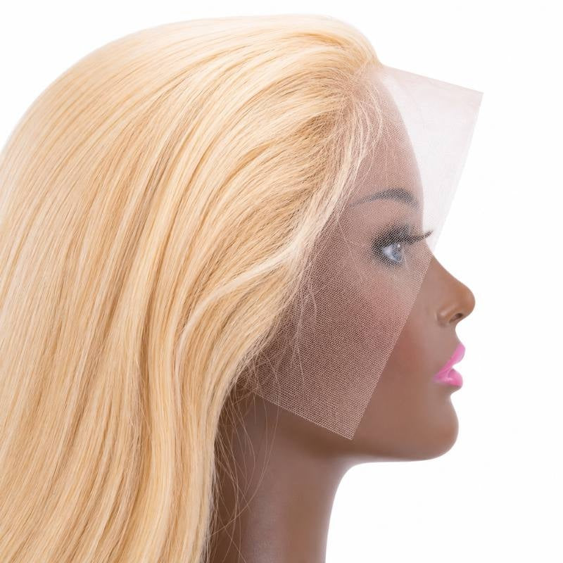 Close-up of the lace front and hairline on a blonde straight human hair wig fitted on a mannequin with fine hairs at the temple
