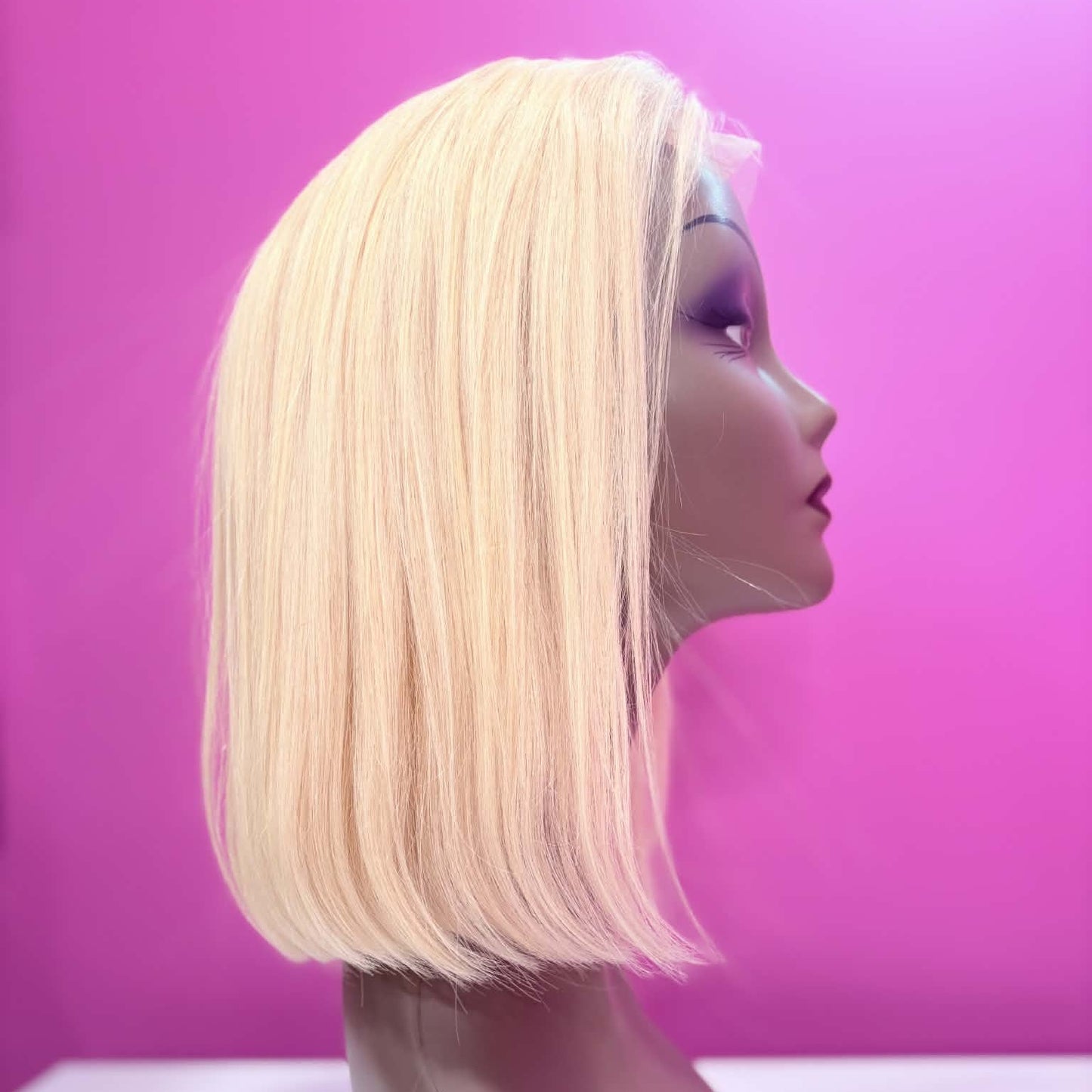 Right side profile of 10 inch blonde straight bob lace human hair wig on mannequin showing sleek straight texture