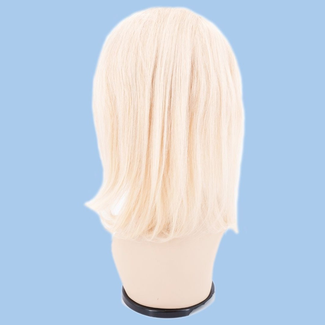 Back of a blonde straight bob human hair wig on a mannequin head against a blue background showing the blunt cut and the wefted length