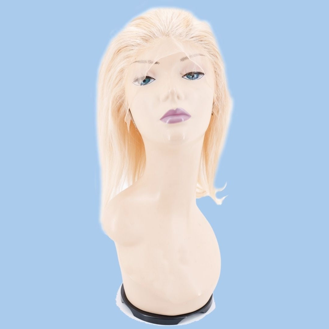 Blonde straight bob human hair wig on a mannequin head against a blue background with the uncut lace front draped over the face