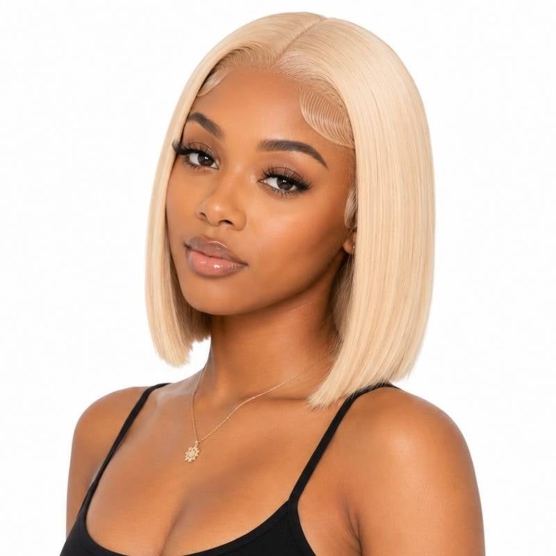 Model wearing a blonde straight bob human hair wig with a middle part, laid edges and a blunt cut at the collarbone