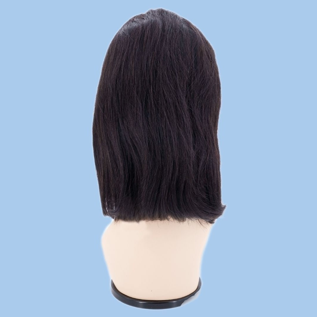 Back view of a natural black straight bob human hair wig on a mannequin head against a blue background showing the blunt cut ends