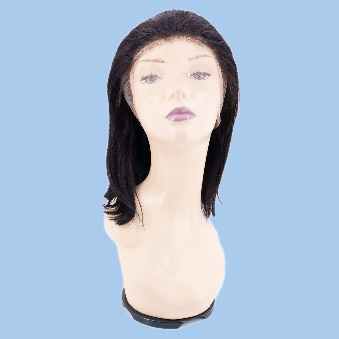 Front view of a natural black straight bob human hair wig on a mannequin with a middle part and untrimmed lace draped over the face