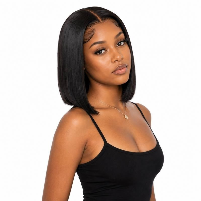 Model in a black top wearing a natural black straight bob human hair wig with a deep part, shown in three quarter view on white
