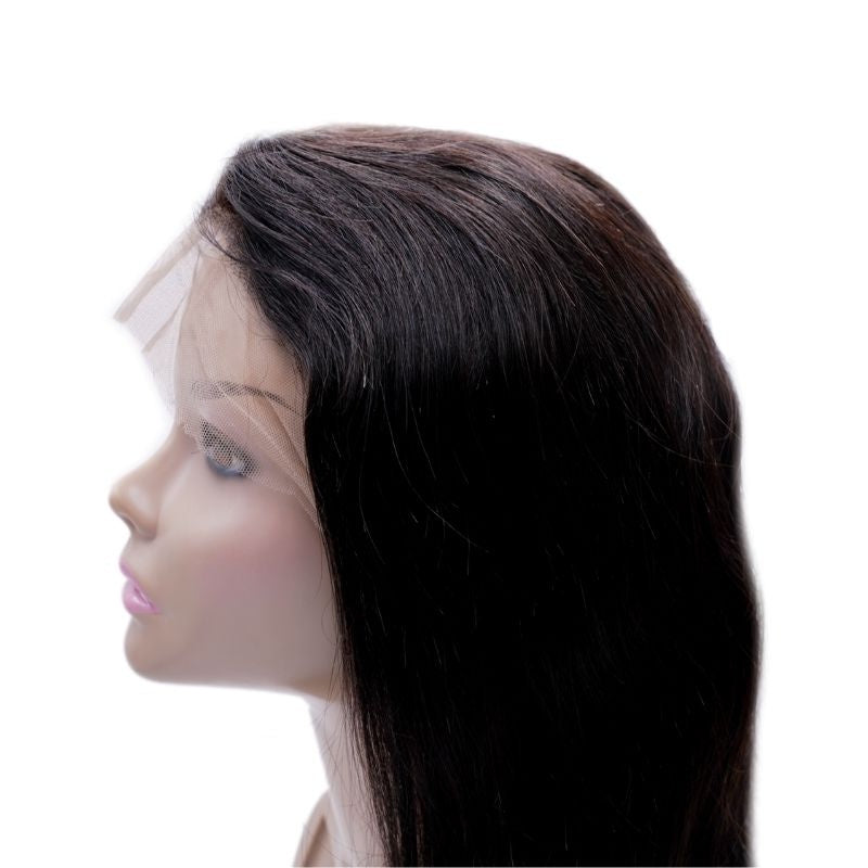 Side profile of a natural black straight human hair wig on a mannequin head with untrimmed lace draped forward over the face