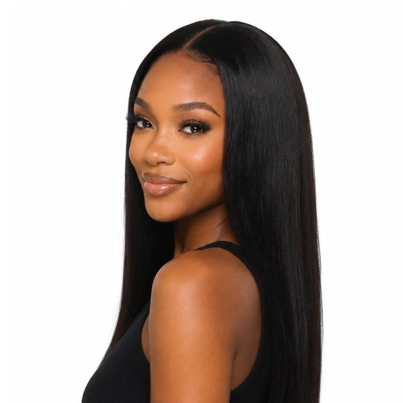 Model turned over her shoulder wearing a long natural black straight human hair wig with a middle part on a white background