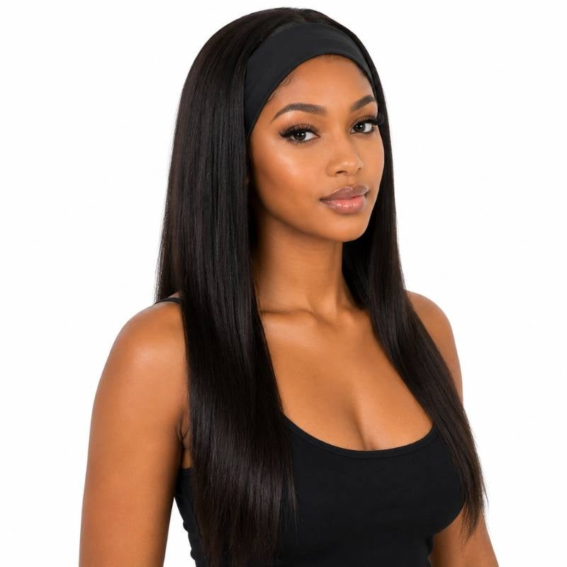 Model wearing a long natural black straight human hair wig with a black fabric headband across the hairline on a white background