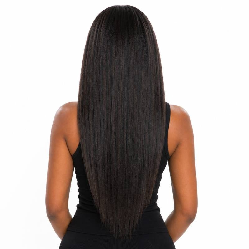 Back view of a model wearing a long natural black yaki straight human hair wig showing the full length and tapered ends