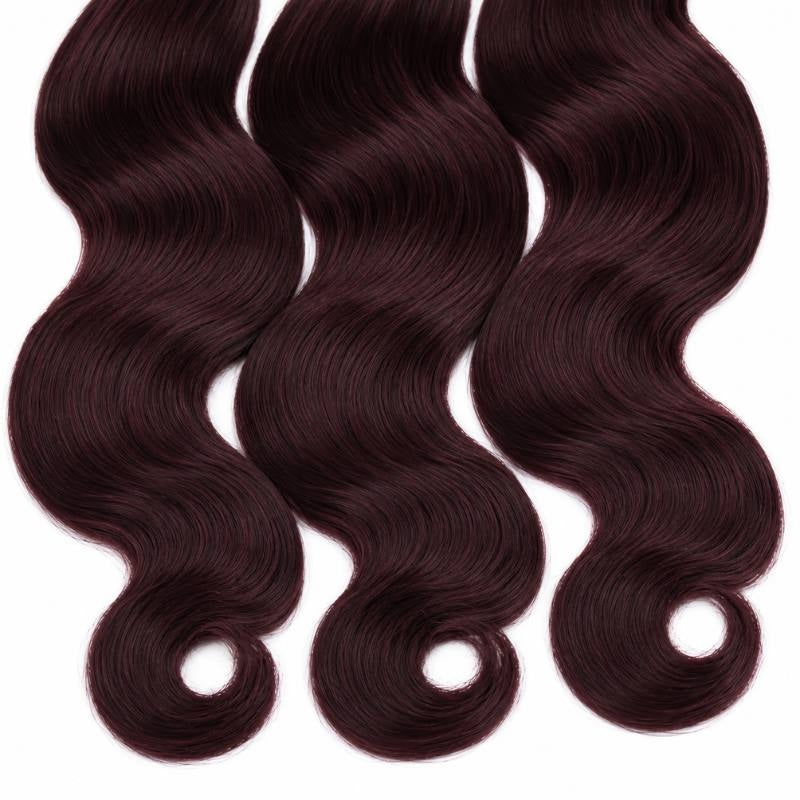 Crop of the lower lengths and curled ends on three bundles of burgundy 99J body wave sew-in hair extensions on white