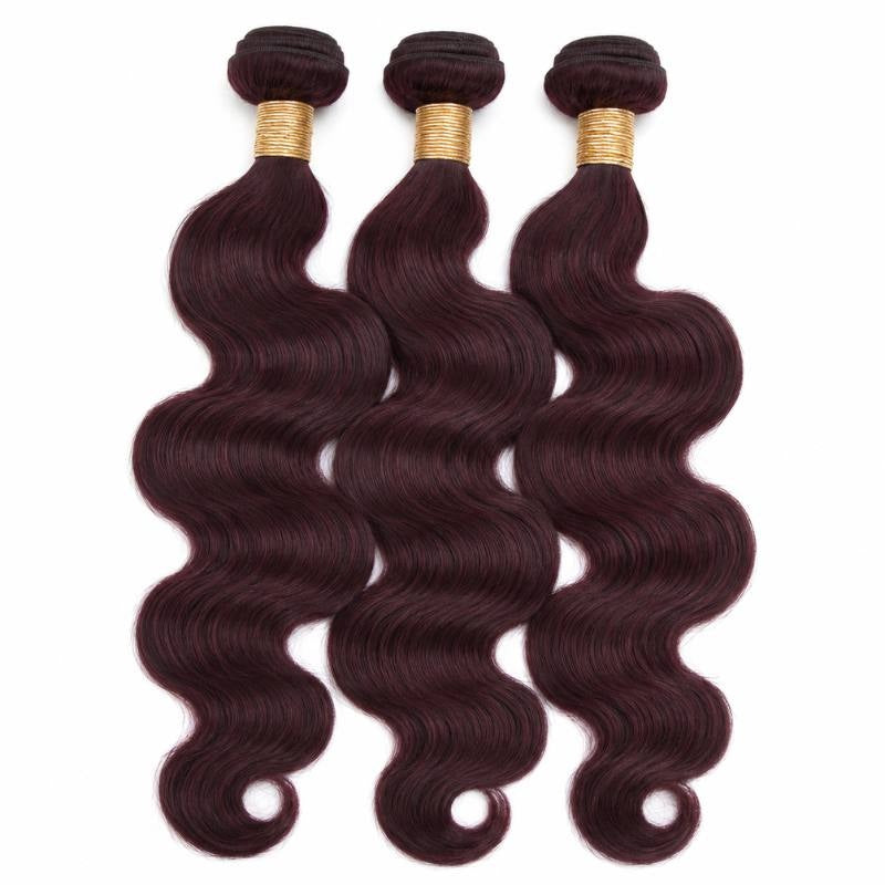 Three bundles of burgundy 99J body wave sew-in hair extensions standing side by side with gold bands at the wefts on white