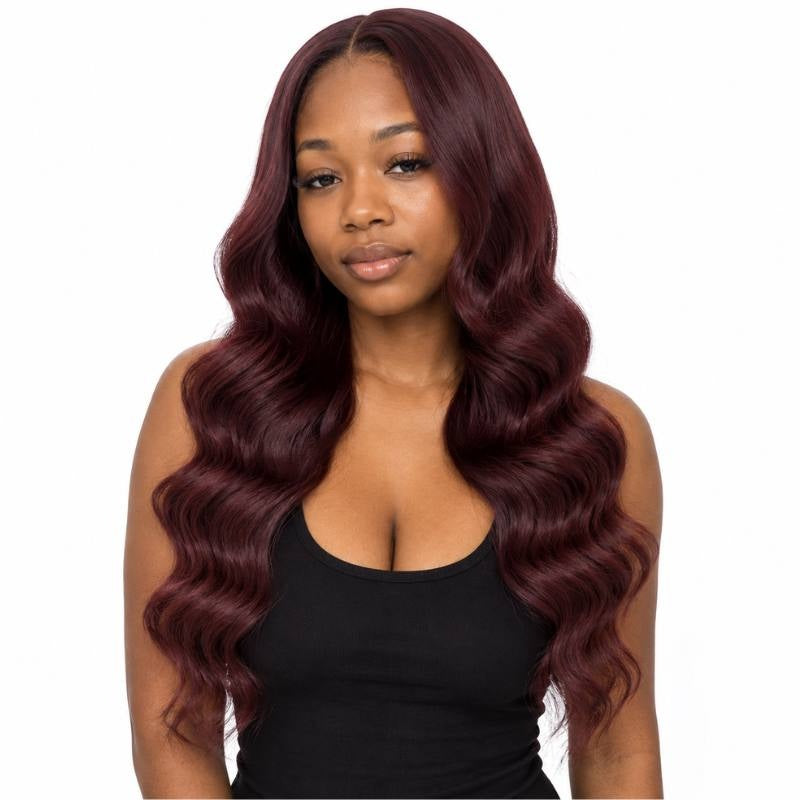 Model facing forward wearing burgundy 99J body wave sew-in hair extensions with a middle part and long waves on white