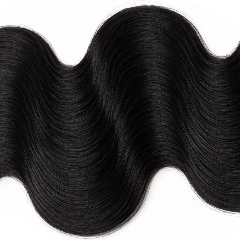 Macro crop of the deep S shaped wave in jet black 1 body wave sew-in hair extensions filling the frame on white