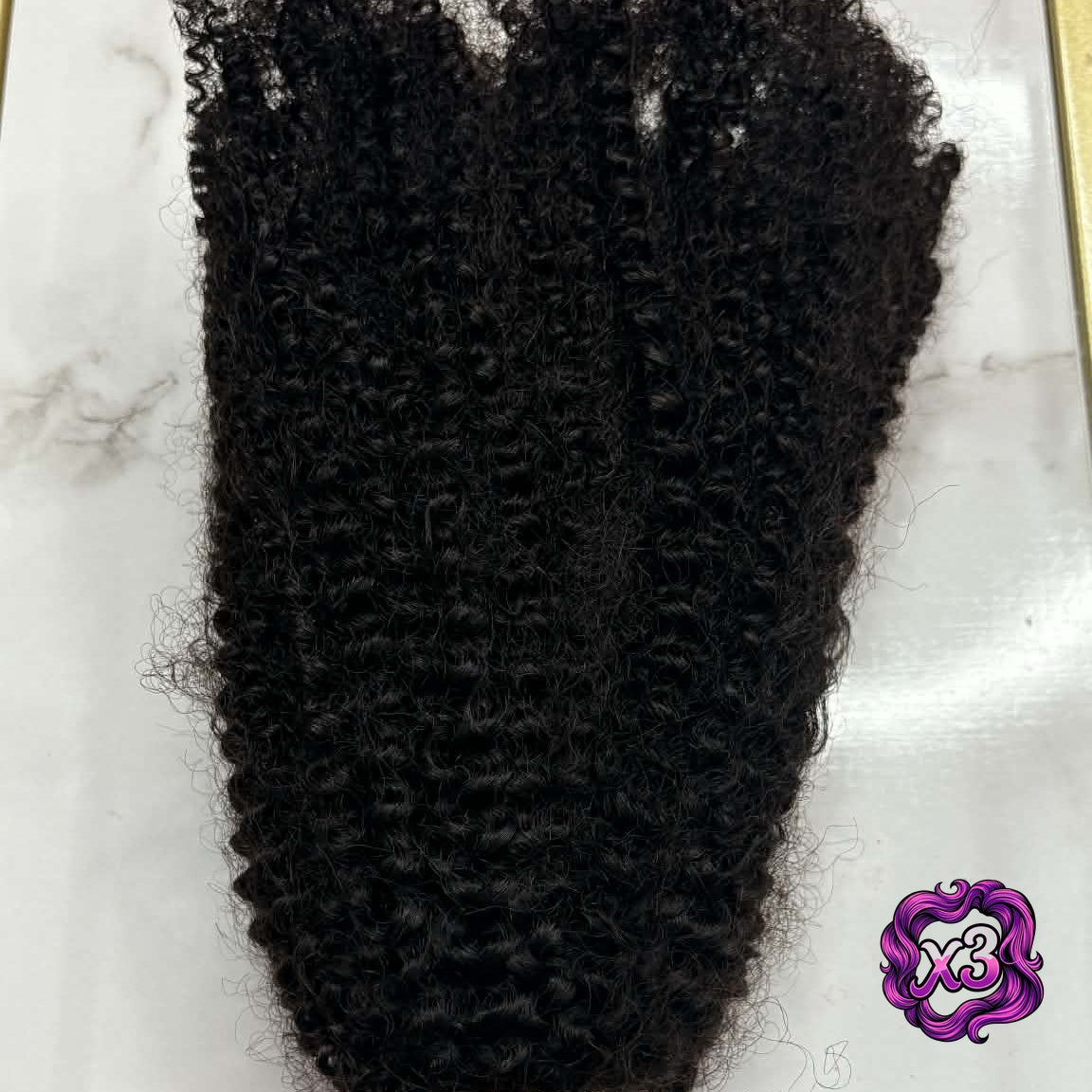 3 bundle deal — 16 inch Brazilian afro kinky curly sew-in hair extensions bundle in gold frame showing tight coils spread across marble surface
