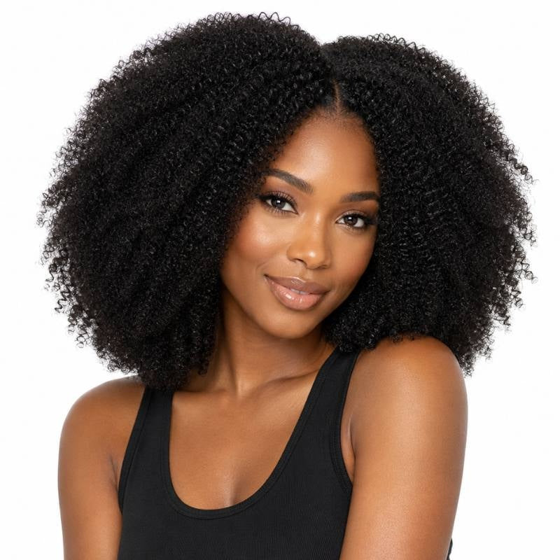Model facing forward wearing natural black 1B afro kinky curly sew-in hair extensions with a middle part and full volume on white