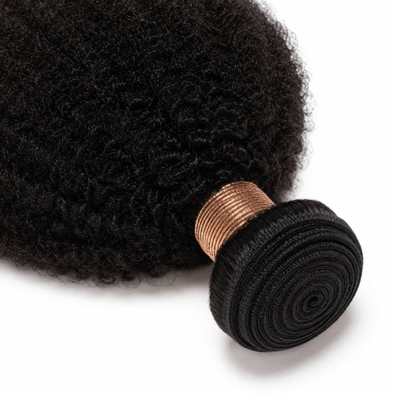 Close-up of the rolled weft on natural black afro kinky curly sew-in hair extensions showing the spiral coiled band and tight curl texture