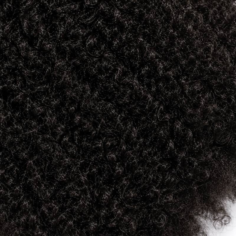 Full frame macro of dense springy coils on natural black afro kinky curly sew-in hair extensions filling the whole picture