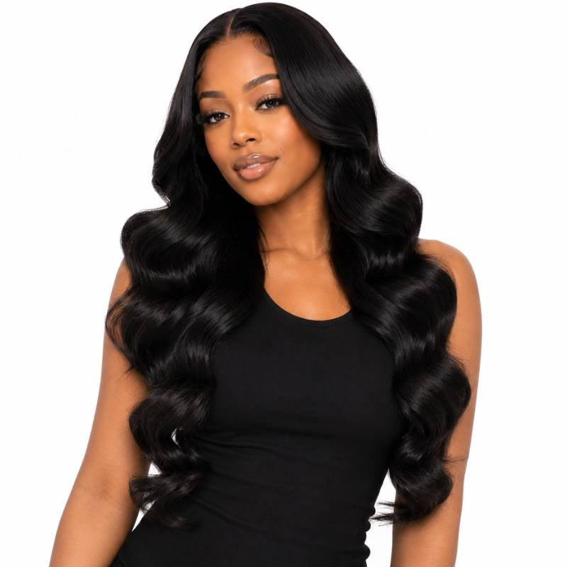 Model on a white background wearing long natural black body wave sew-in hair extensions styled in soft S waves past the chest