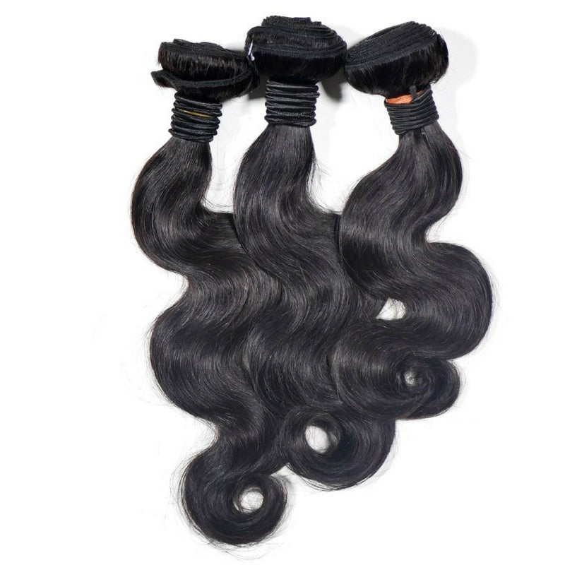 Three bundles of natural black body wave sew-in hair extensions hanging side by side on a white background with folded wefts tied at the top
