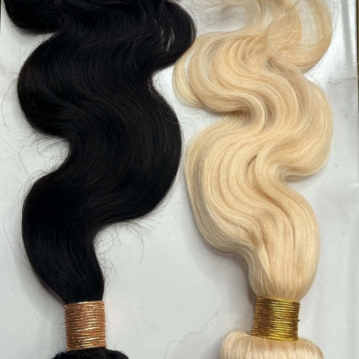 Blonde 613 and natural black 1B body wave sew-in hair extensions bundles side by side showing matching wave pattern in two colors