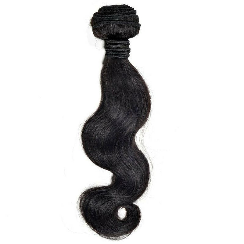 Single bundle of natural black body wave sew-in hair extensions hanging on a white background with the folded weft tied at the top