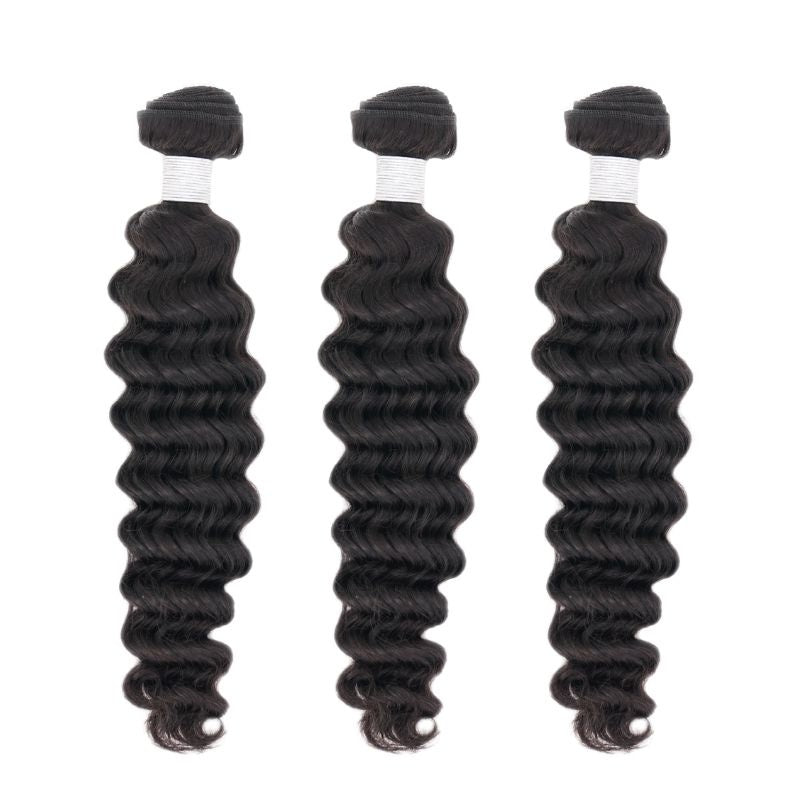 Three evenly spaced bundles of natural black deep wave sew-in hair extensions on white with white thread wrapped under each weft