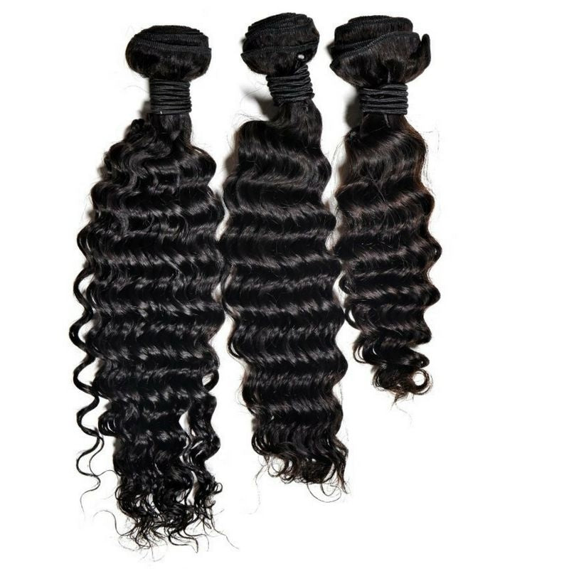 Three bundles of natural black deep wave sew-in hair extensions hanging side by side on white with folded wefts tied at the top
