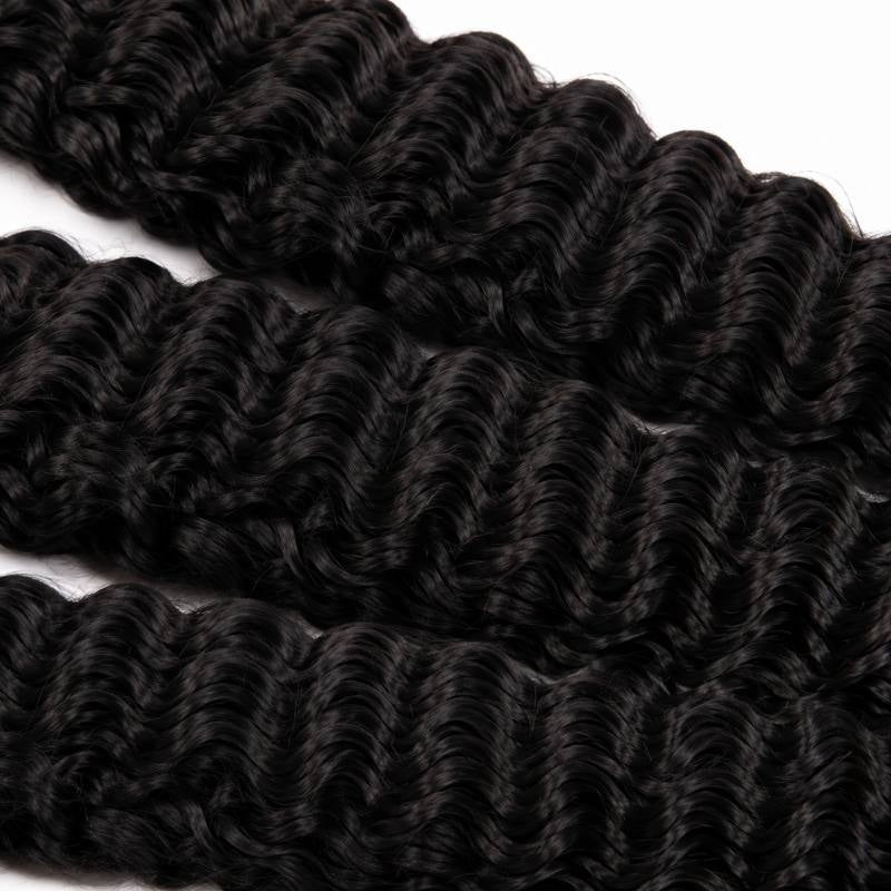 Macro close-up of natural black sew-in hair extensions filling the frame with a tight repeating S-shaped wave pattern