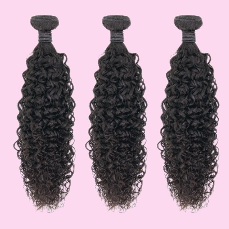 Three bundles of natural black kinky curly sew-in hair extensions hanging side by side with wrapped weft tops on a pink backdrop