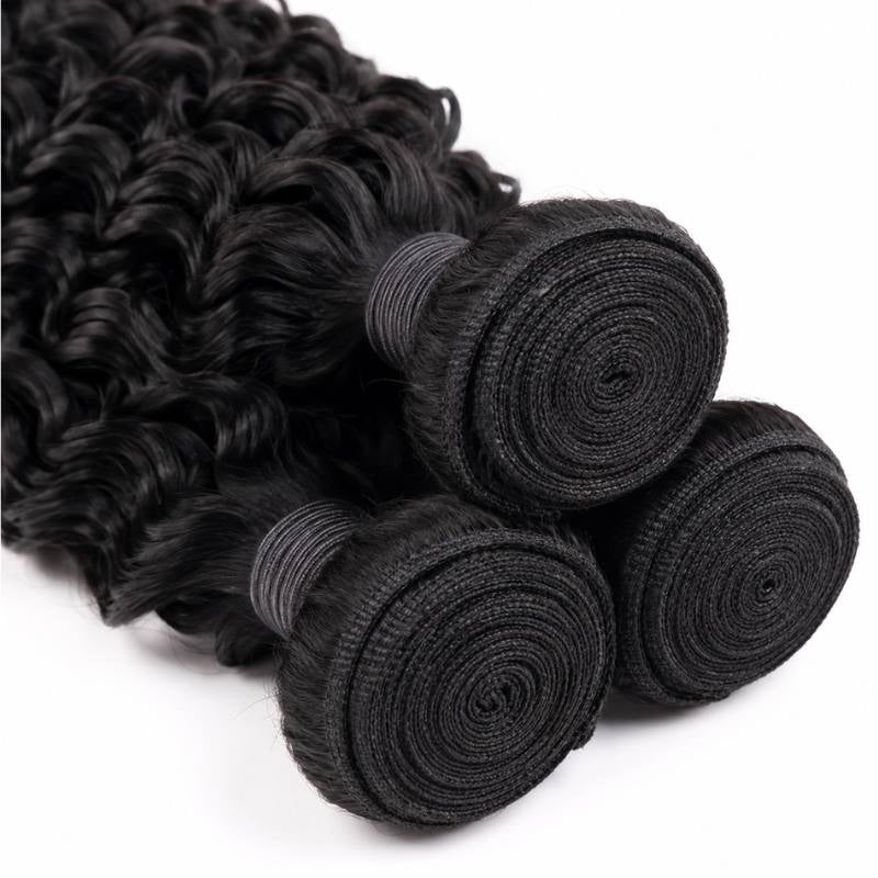 Close-up of three coiled weft tops on natural black kinky curly sew-in hair extensions showing the spiral rolled stitching and thread wrap