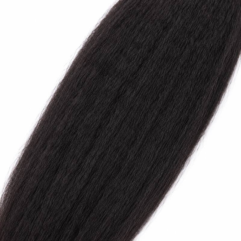 Macro close-up of the mid shaft of natural black kinky straight sew-in hair extensions showing the lightly crimped straight texture
