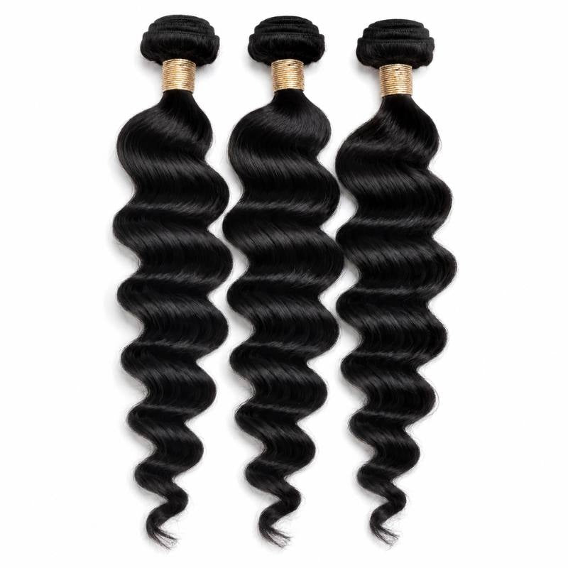 Three bundles of natural black loose wave sew-in hair extensions hanging on a white background with gold thread wrapped around each weft