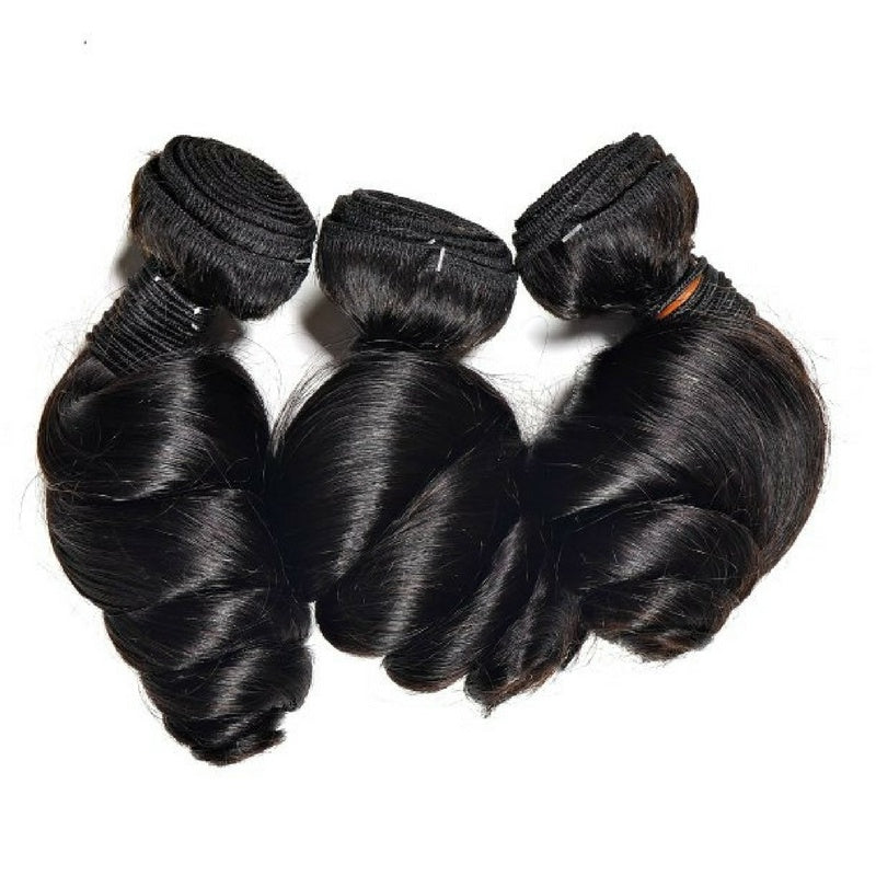 Three bundles of natural black loose wave sew-in hair extensions laid flat on a white background with the folded wefts grouped at the top
