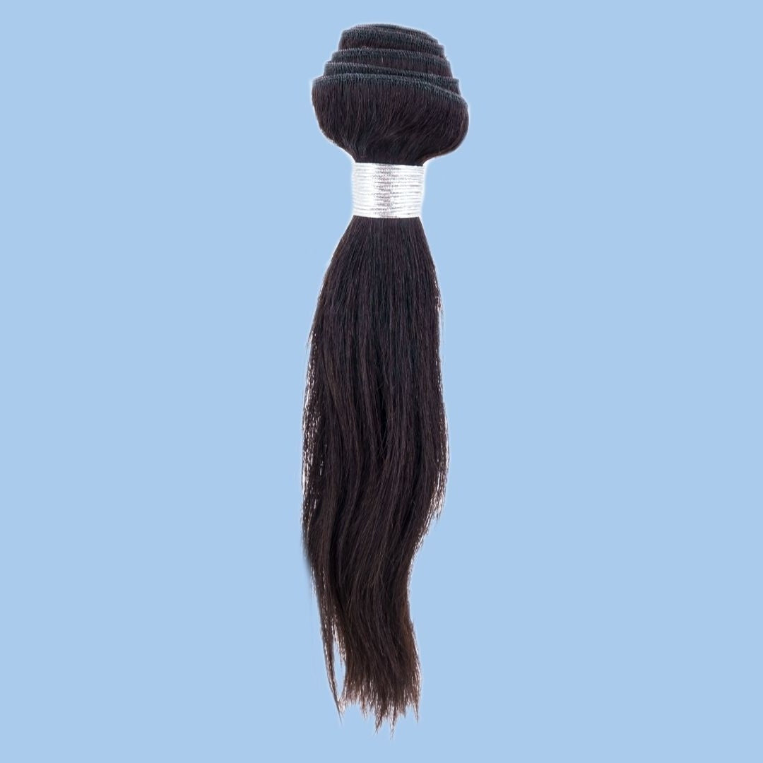 Single bundle of natural black straight sew-in hair extensions on a blue backdrop showing the stacked weft folds above a white wrap band