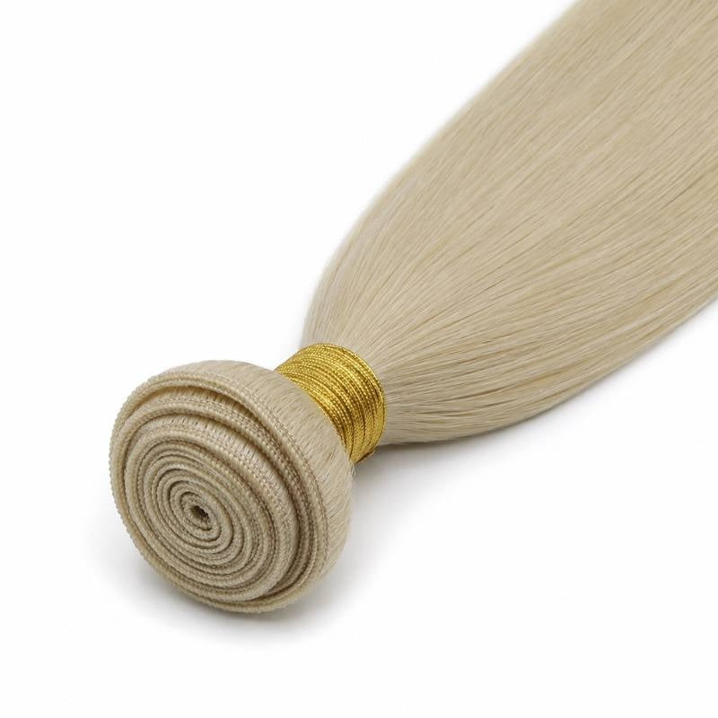Close-up of the spiral coiled weft on blonde straight sew-in hair extensions secured with a gold thread wrap