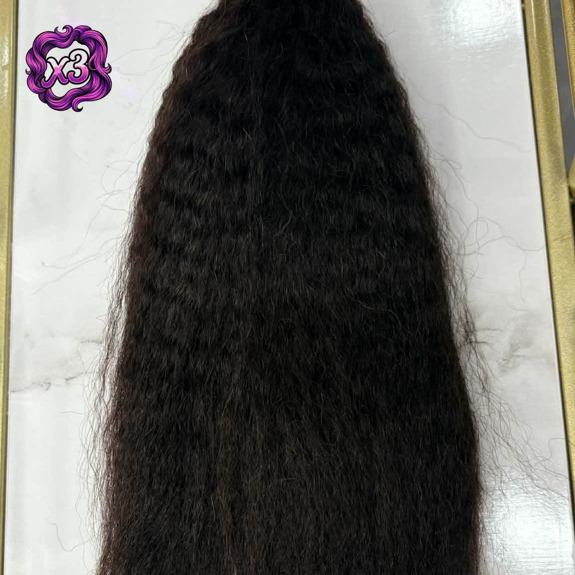 3 bundle deal — 16 inch Brazilian kinky straight sew-in hair extensions bundle on marble in gold frame showing full length and natural blow-out texture