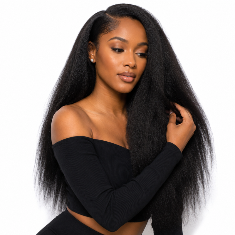 Model on a white background holding a section of natural black kinky straight sew-in hair extensions worn long with a middle part