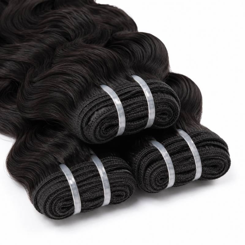 Close-up of folded wefts of natural black sew-in hair extensions held by clear tape tabs with waves spilling out behind