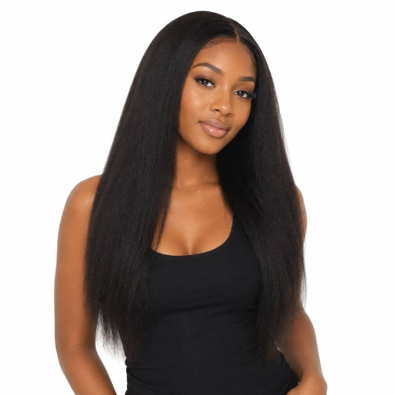 Model on a white background wearing natural black yaki straight sew-in hair extensions with a middle part and a textured straight finish