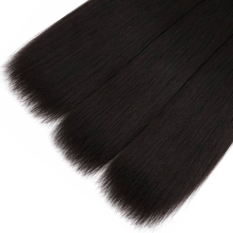 Three lengths of natural black yaki straight sew-in hair extensions laid with their cut ends staggered on a white backdrop