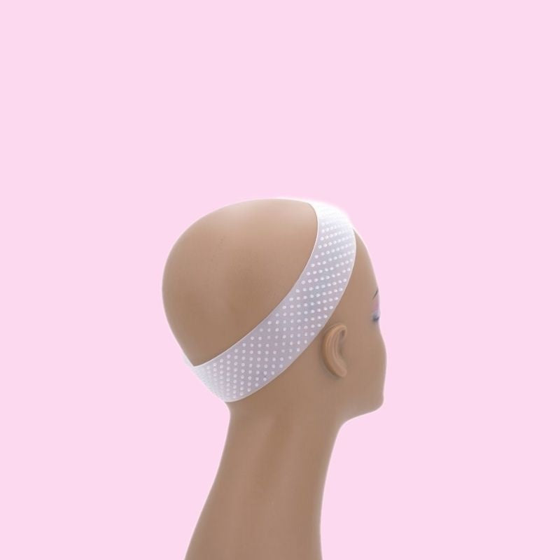Clear dotted silicone wig grip band on a mannequin head seen in profile, an accessory for securing wigs and hair extensions