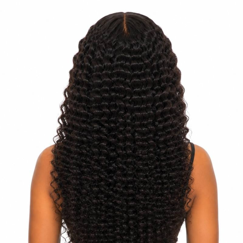Back view of a model wearing natural black afro kinky curly tape-in hair extensions showing the curl pattern from crown to ends