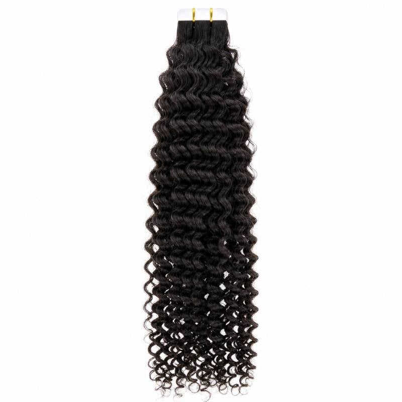 Full length of natural black afro kinky curly tape-in hair extensions hanging from the tape tabs against a white backdrop