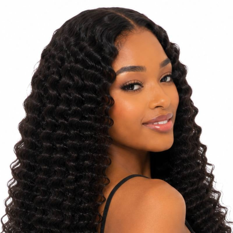 Model turning her shoulder to show natural black afro kinky curly tape-in hair extensions with spiral curls down the length