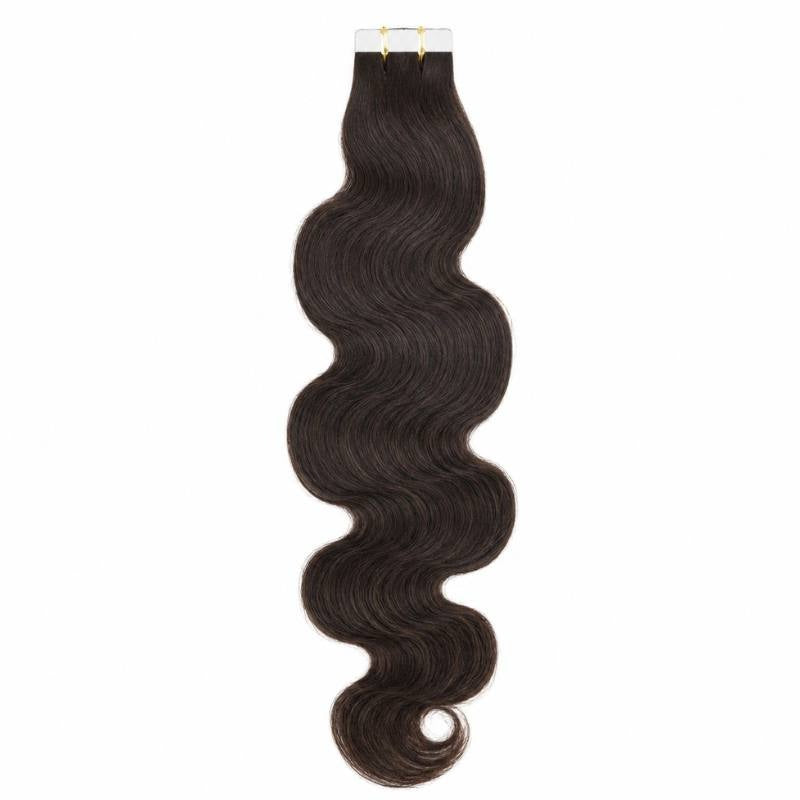 Natural black body wave tape-in hair extensions hanging at full drop from the tape tabs against a white backdrop