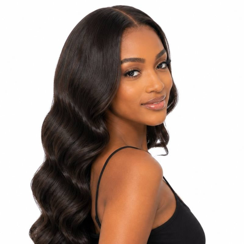 Model turned to the side showing natural black body wave tape-in hair extensions with soft S waves through the length